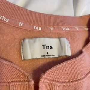 aritzia tna pink quarter button up crewneck sweater